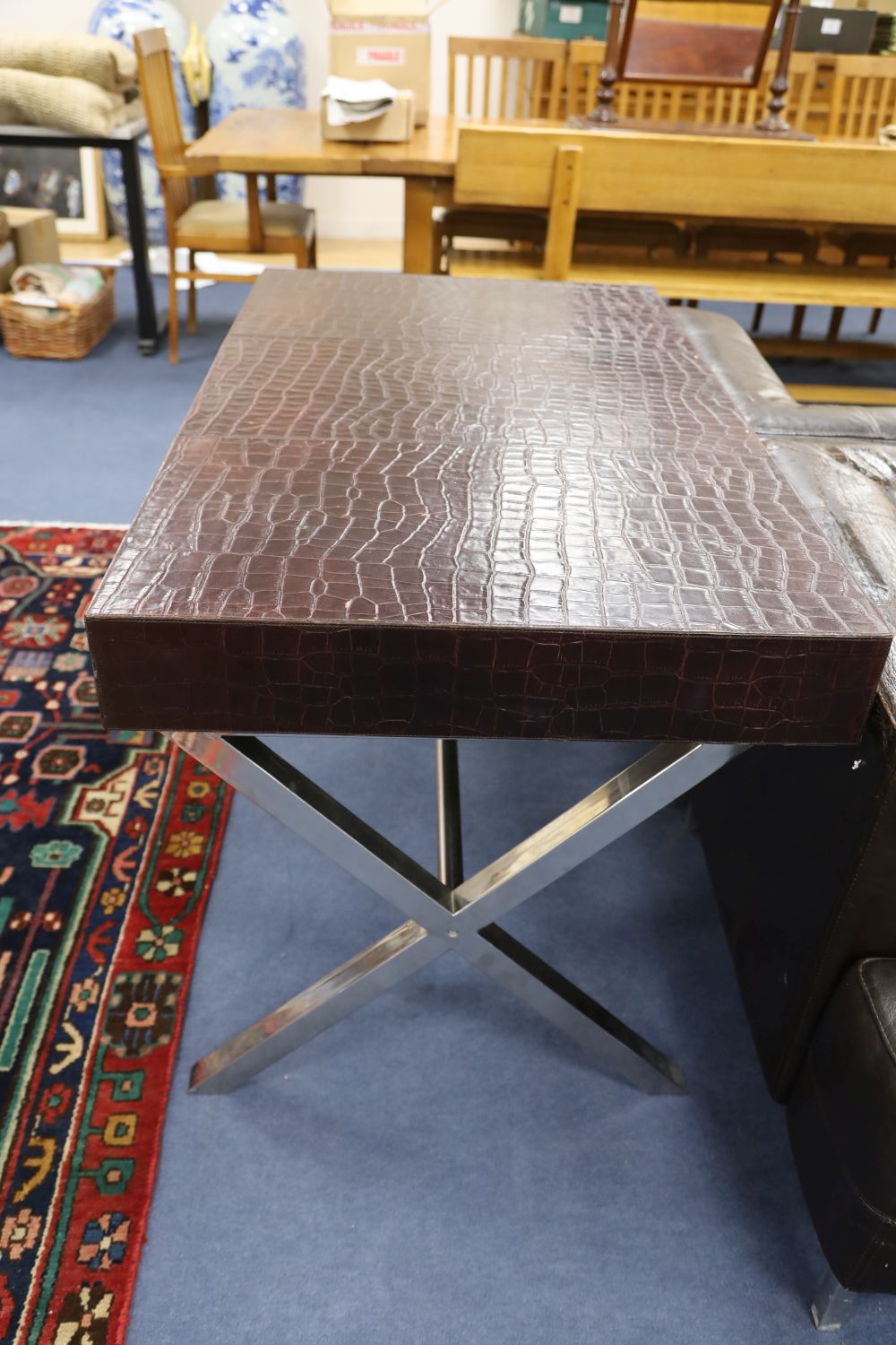 An Andrew Martin faux crocodile skin and chrome desk, width 120cm depth 70cm height 75cm